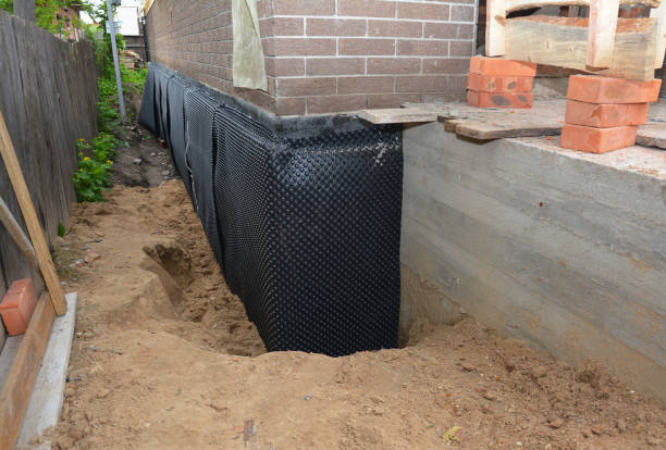 SJ Waterproofing Pros technician performing targeted Sump Pump Installation assessment in Mason, TN